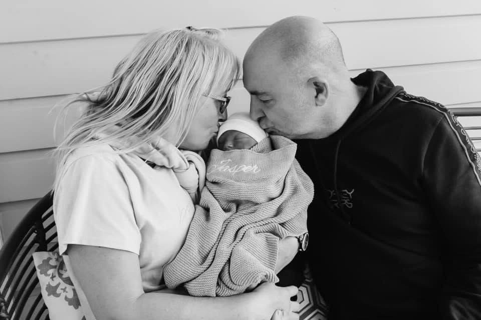 Jasper held tenderly by his family